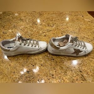 Side view of golden goose sneakers